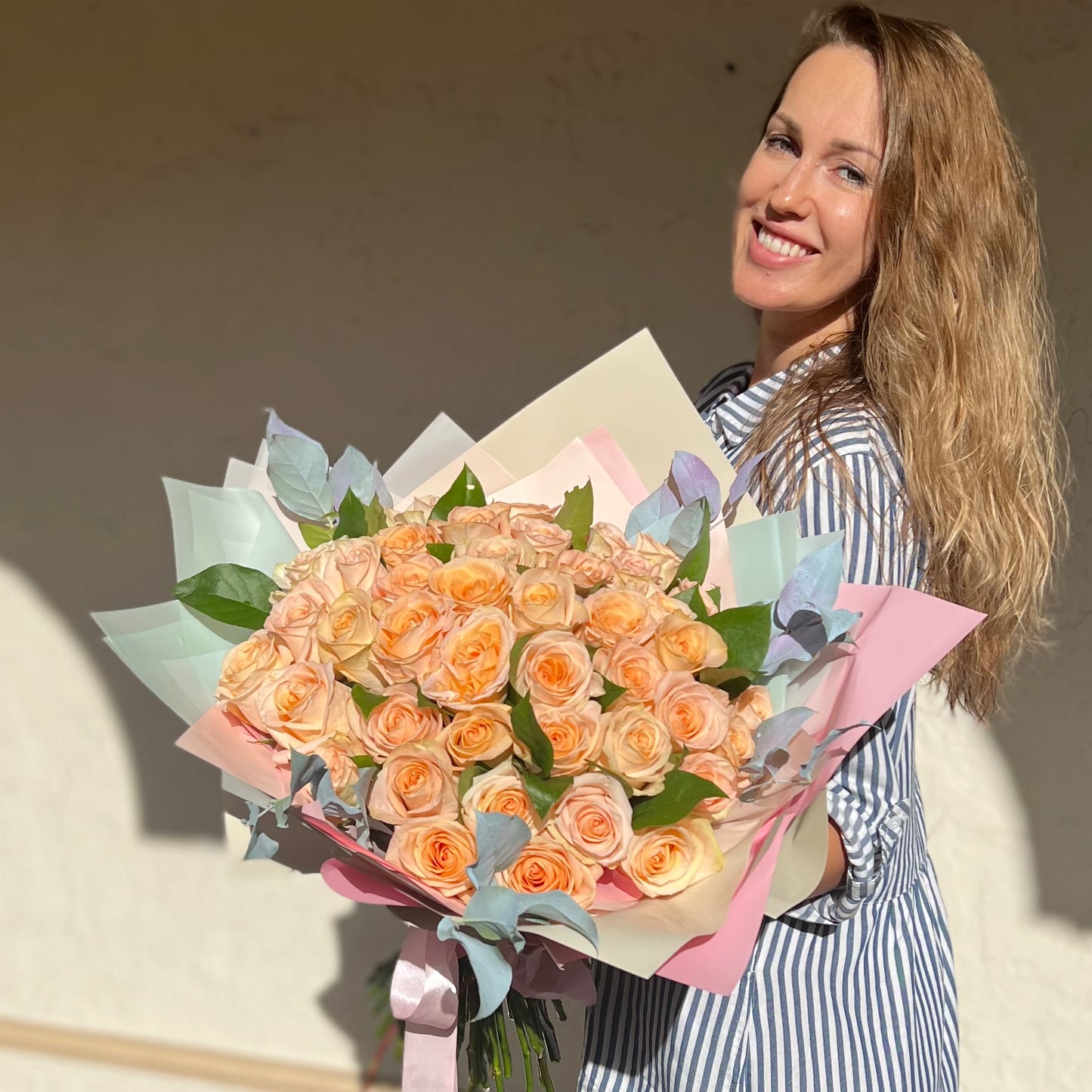 brown hair women holding flowers