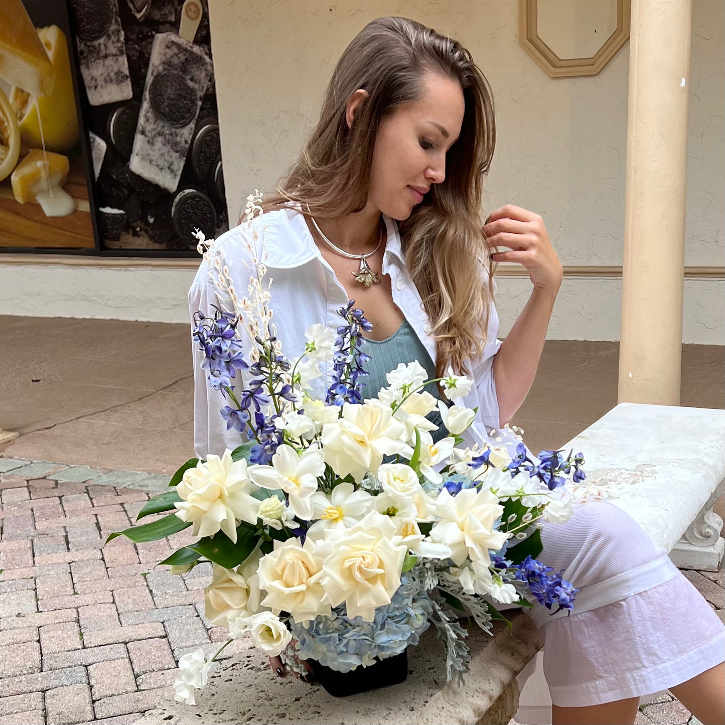 A beautiful woman with Blue and White Gift vase