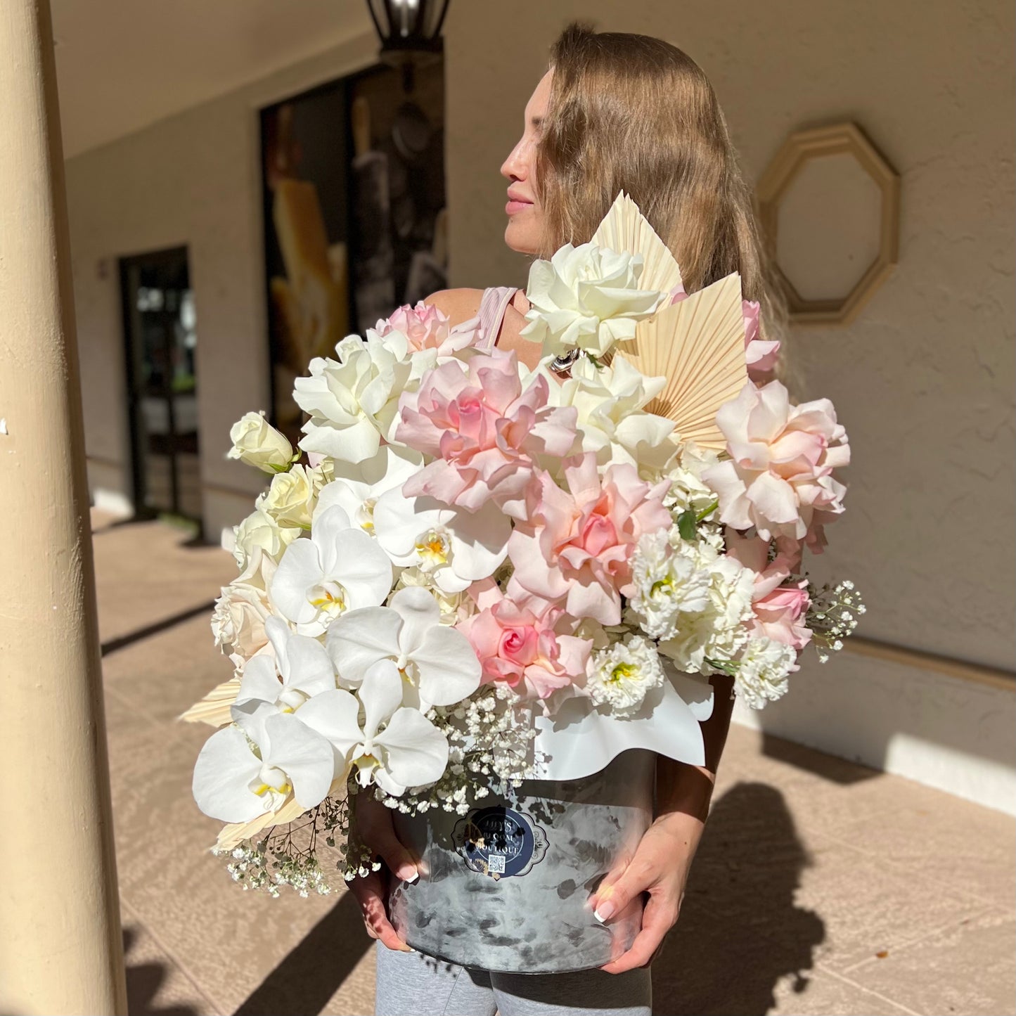 A woman holding A Bunch Of Happy Thoughts box