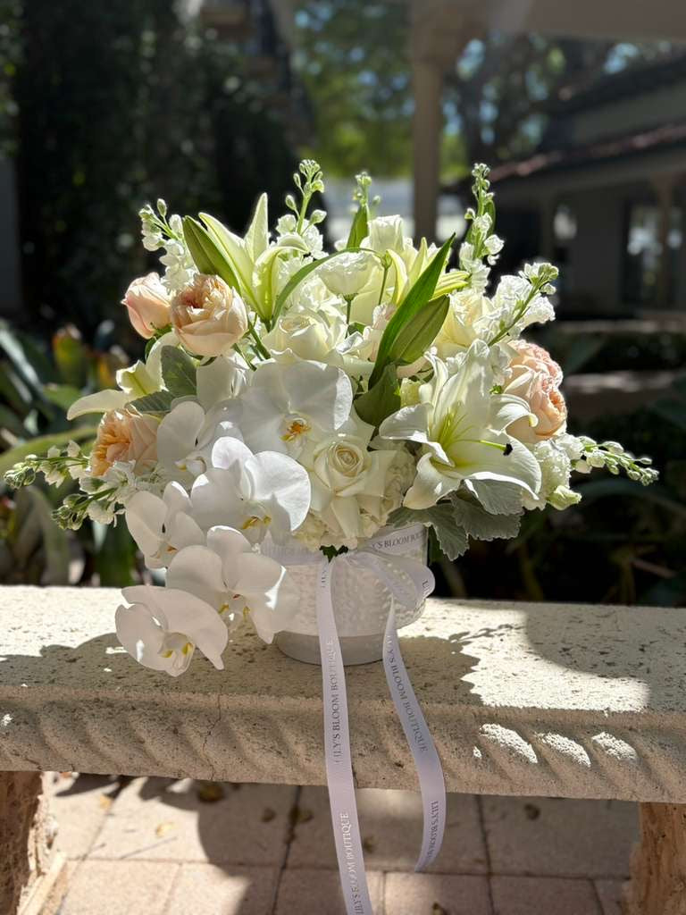 white lilies and orchids Orchid's Garden by Lily's Bloom