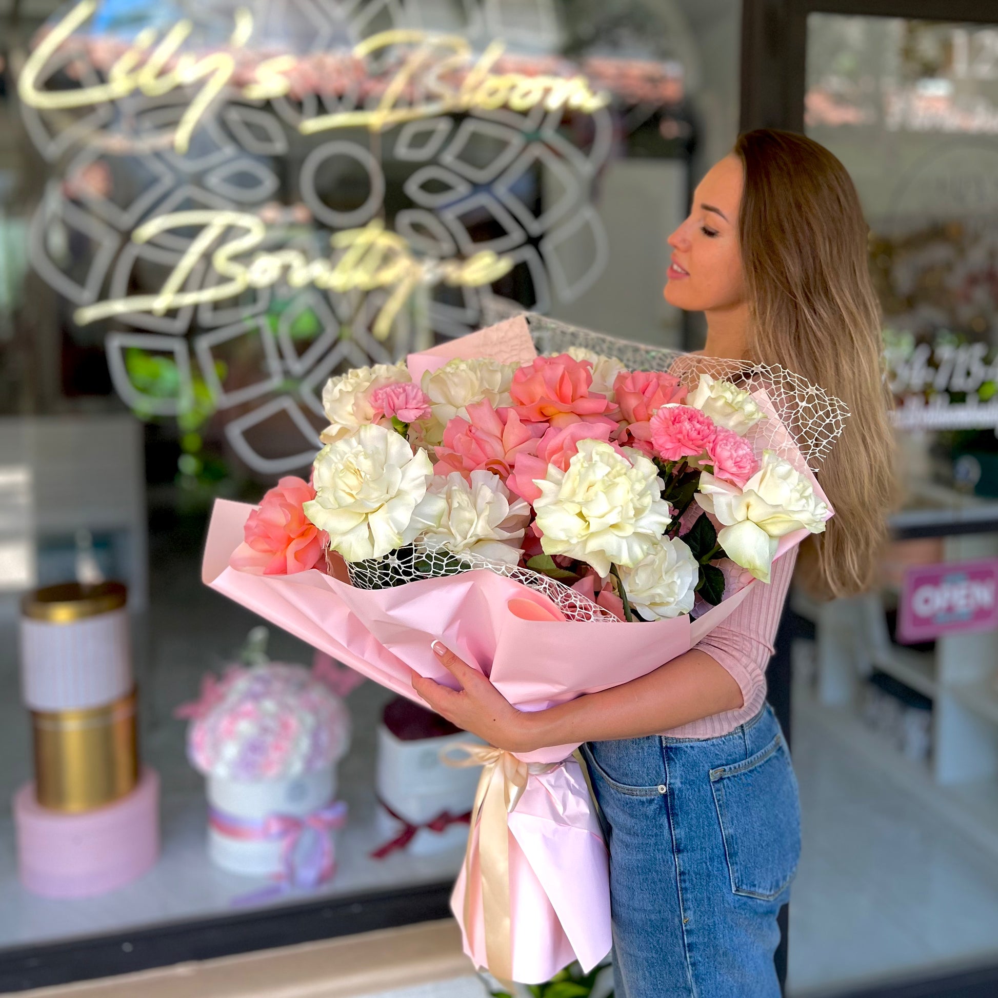 Women holding beautiful pink and white bouquet