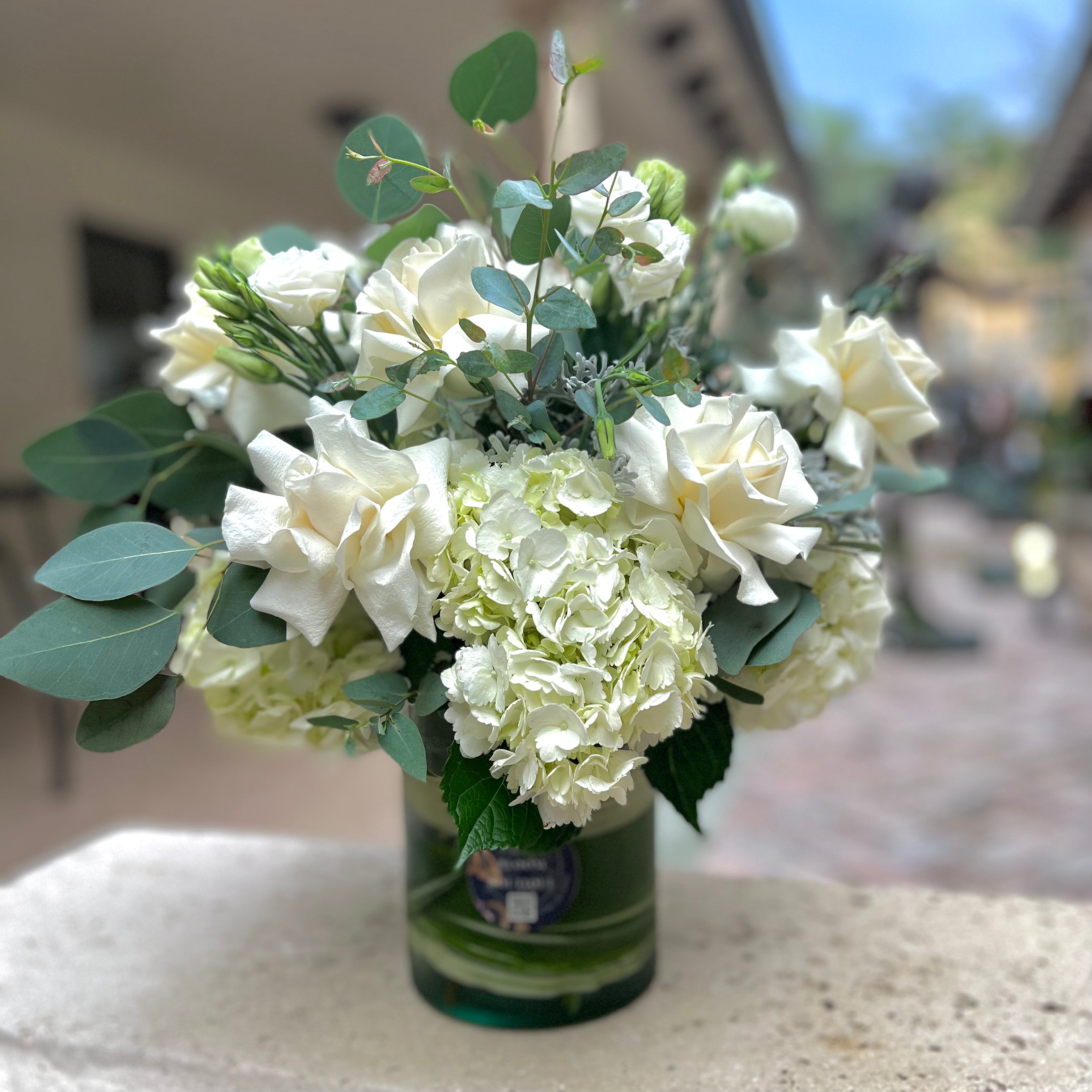 White Round Vase on a concrete bench 