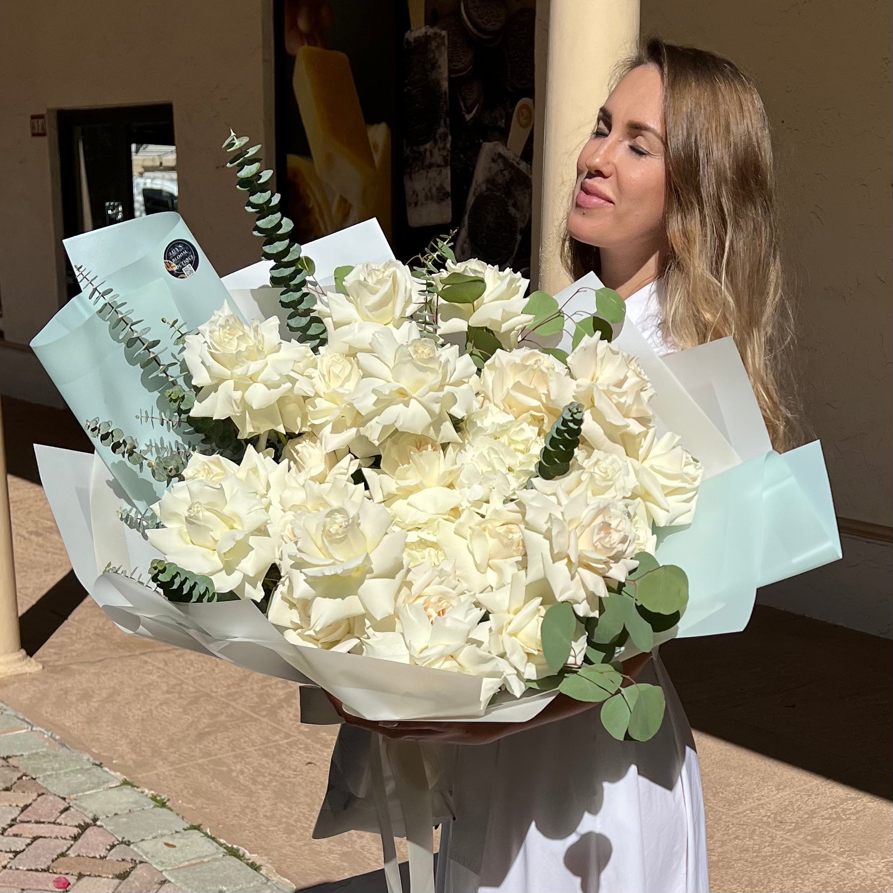 A woman holding Perfect Tiffany Bouquet