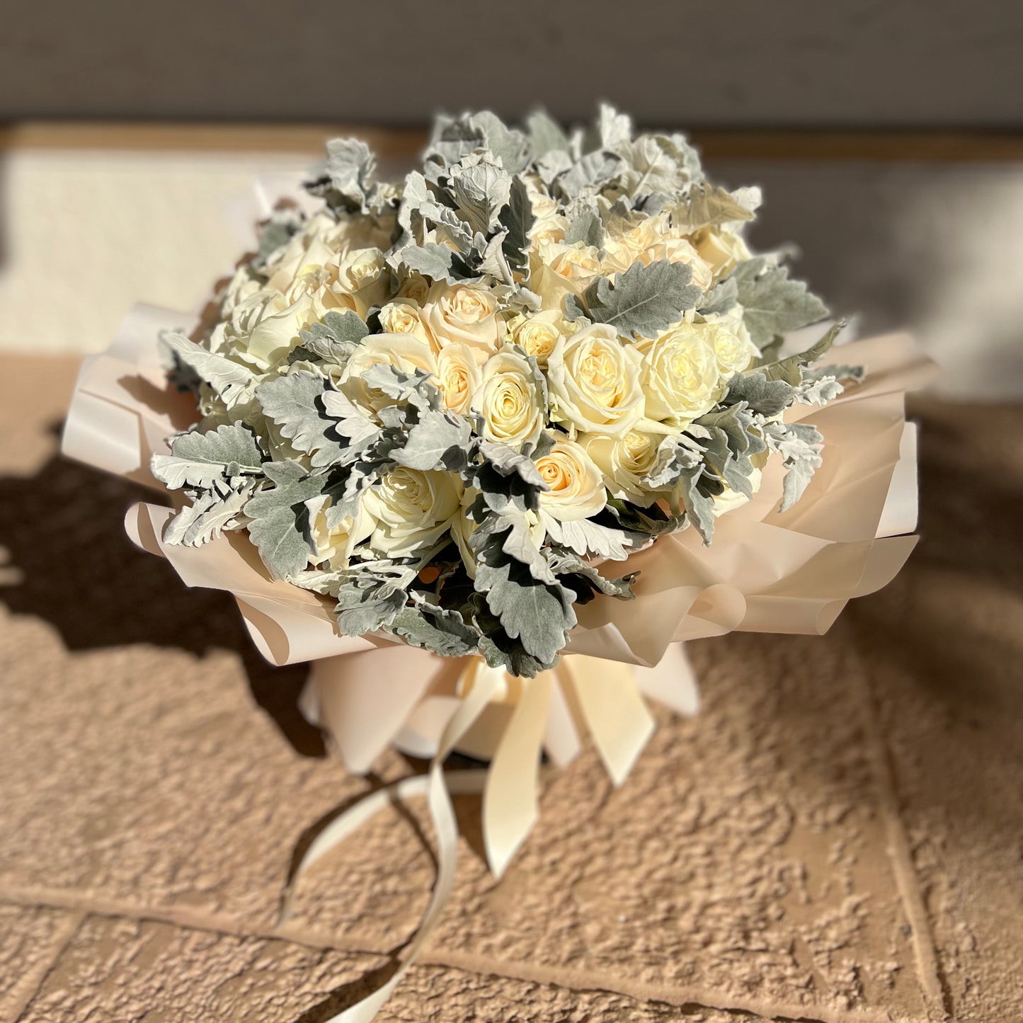 Bouquet of white roses on the floor