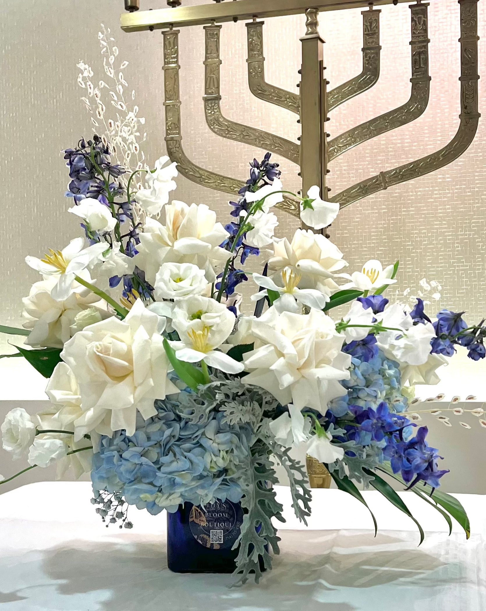 Blue and white flowers in a blue vase